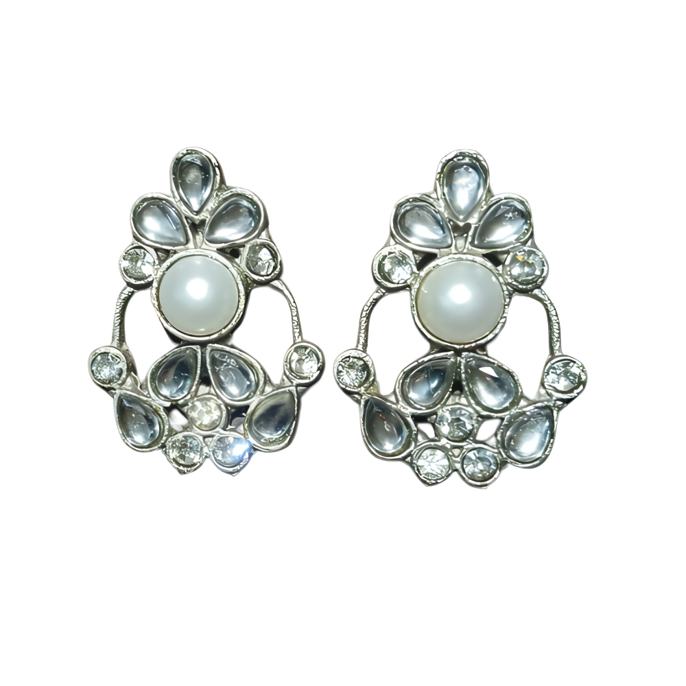 Pair of silver earrings with kundan stones .