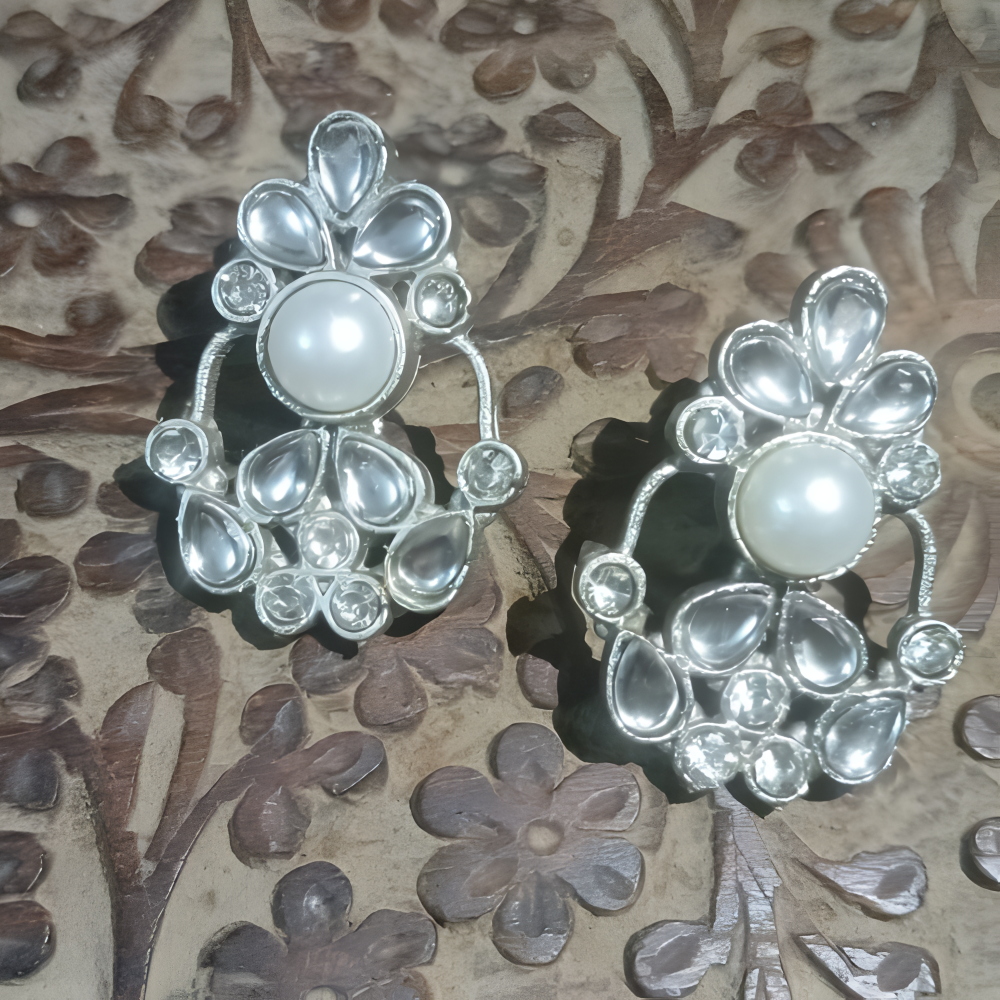 Beautiful silver stud earrings with white stone .