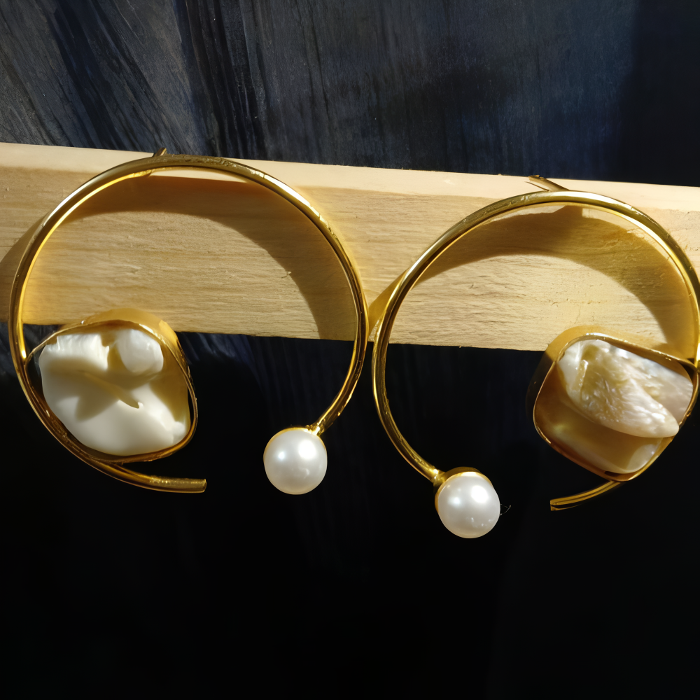 Gold earrings with white uncut stones