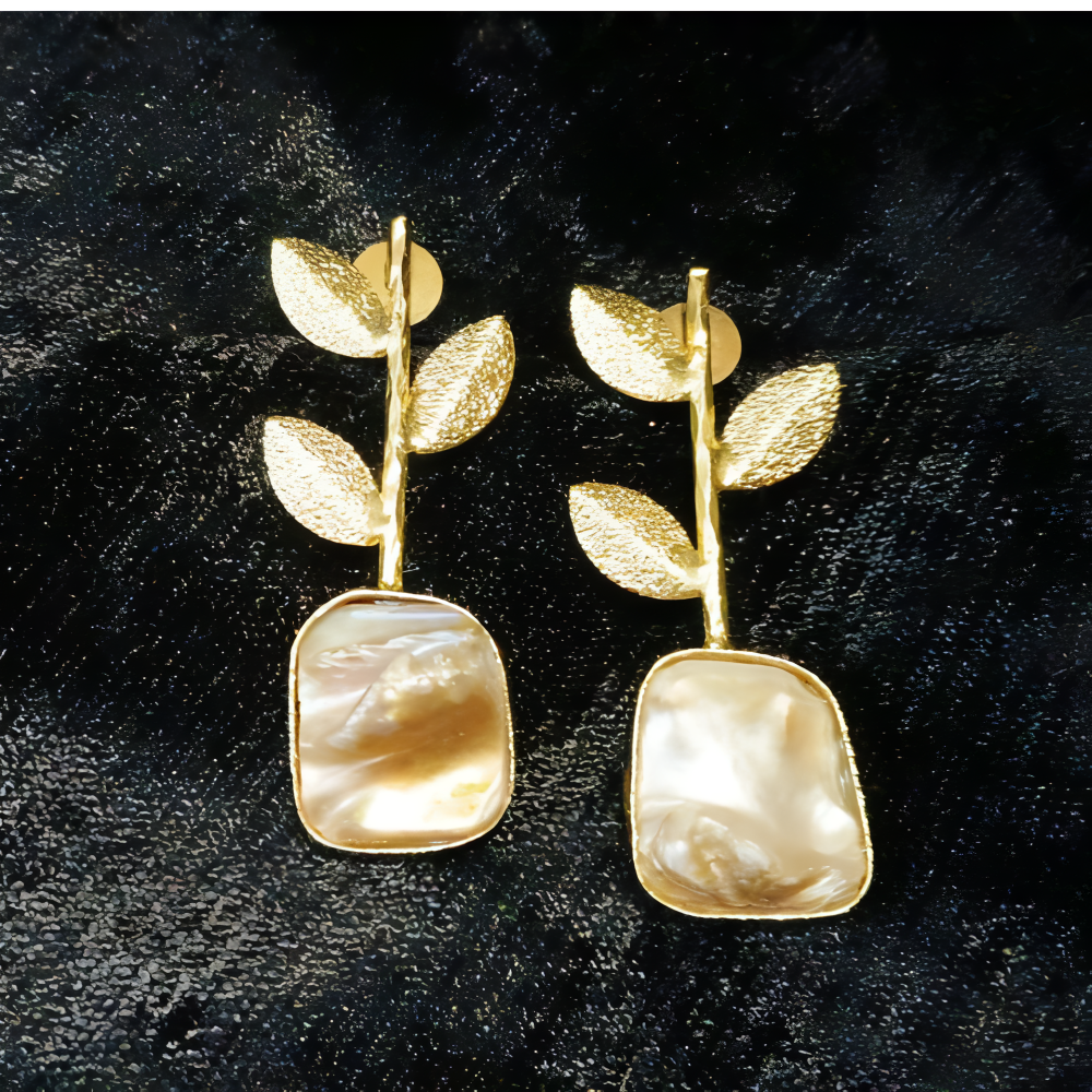 Stylish gold leaf earrings with square pearl-like stones
