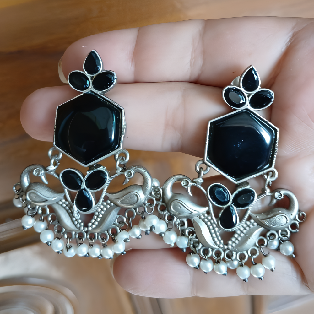 Silver earrings with peacock designs ,black gemstones & pearls