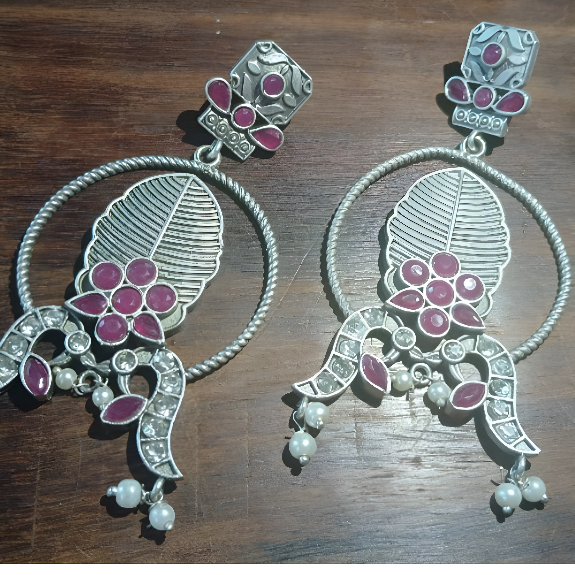 Pair of long silver oxidised earrings with  kundan stones