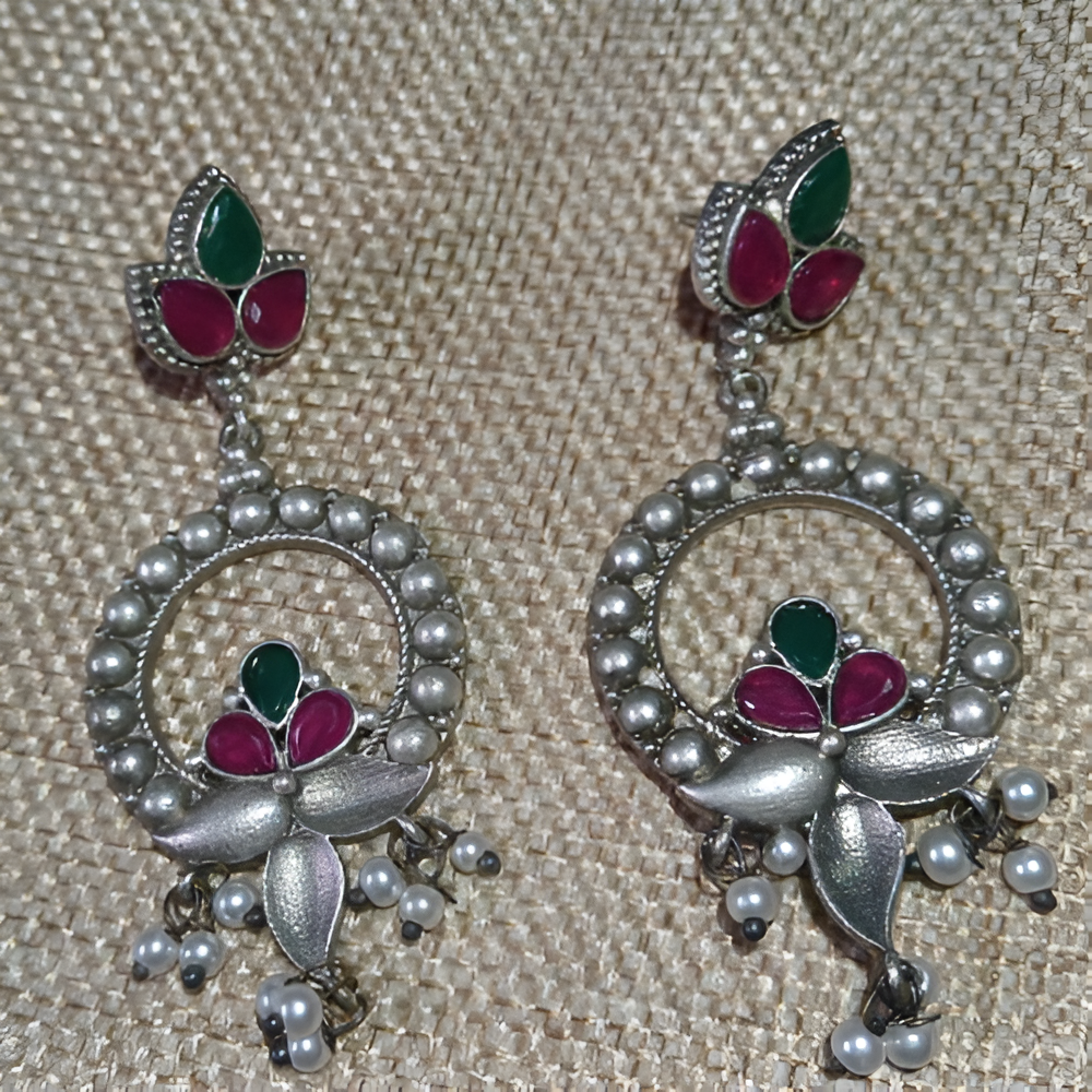 Women's ornate silver oxidised dangle earrings with green, pink, and pearl details