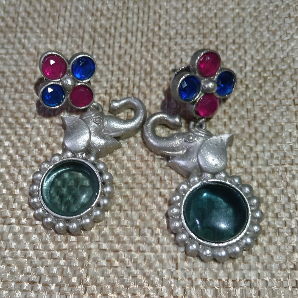 Colorful kundan stones elegant traditional elephant design earrings .