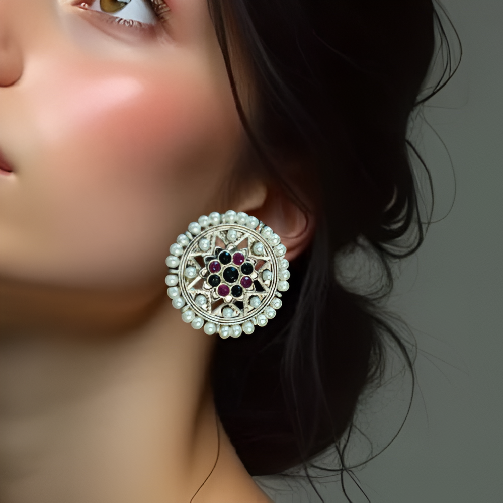 Round Oxidised Temple Inspired Big Stud Jewellery adorned with all around pearl and kundan at centre .