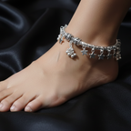 Oxidized Silver Charm Ankle Kada on a woman's ankle