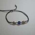 Evil Eye Anklet on Solid Surface