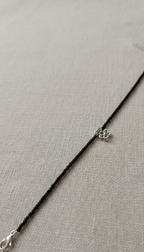 Minimalist anklet with adjustable chain on a woman's ankle
