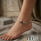 Anchored anklet on a foot with a neutral background