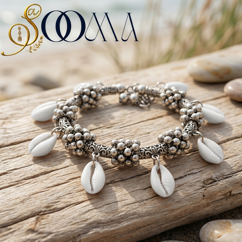 Silver bracelet with shell charms on a wooden log with a blurred natural background