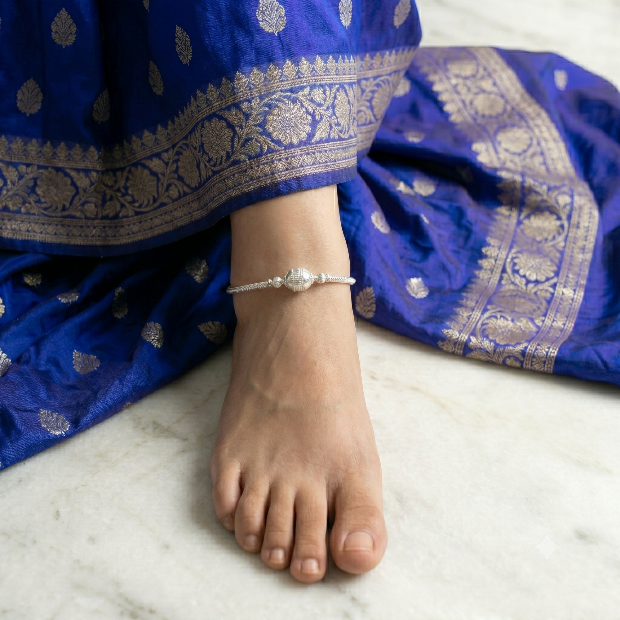 Minimalist silver bead adjustable anklet for women close up shot