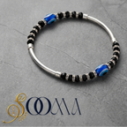 Sleek silver-toned protective evil eye ankle jewelry for professional outfits