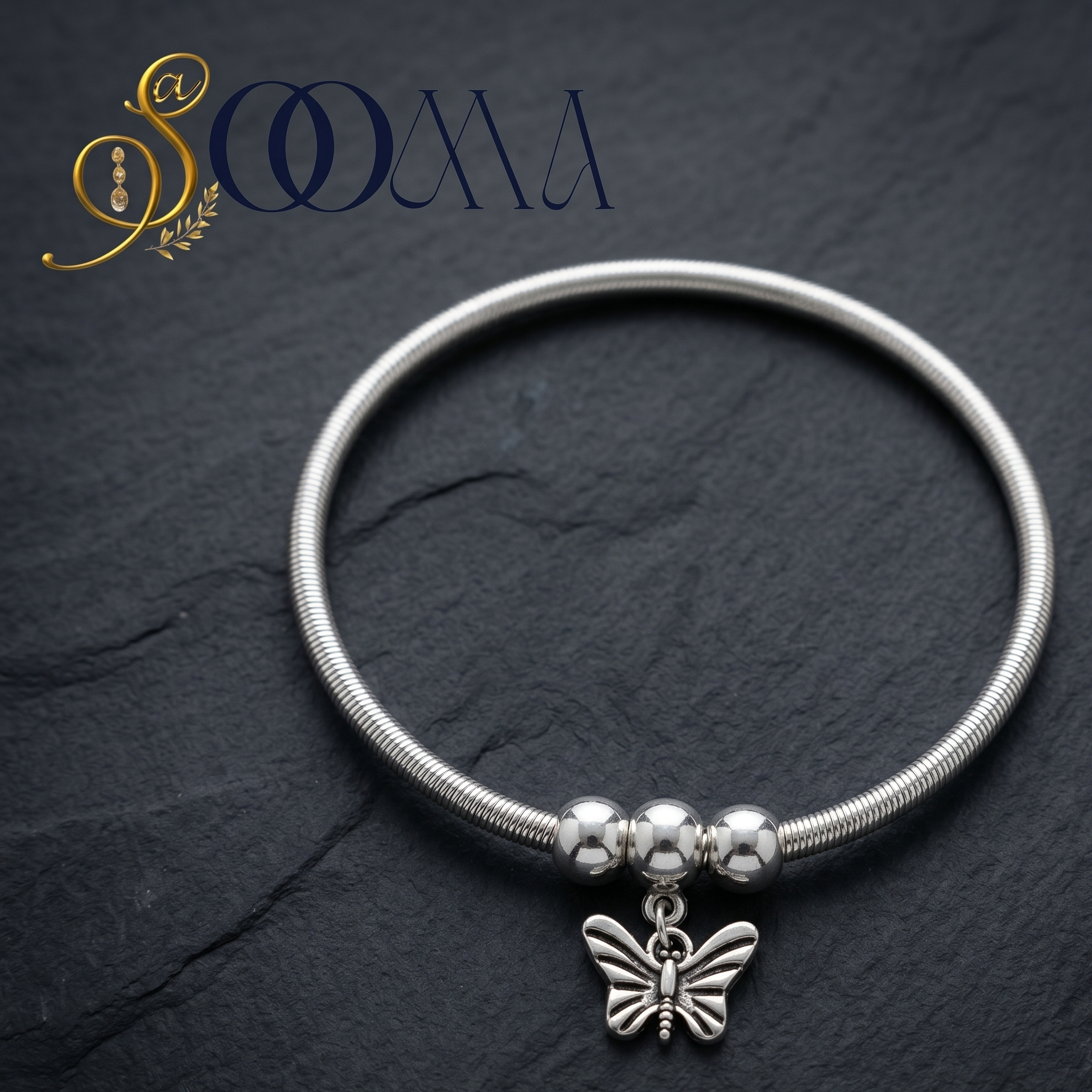 Polished silver ankle jewelry with an antique-finished butterfly charm close up