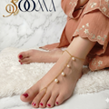 Delicate gold-toned toe ring anklet chain with hanging white pearls