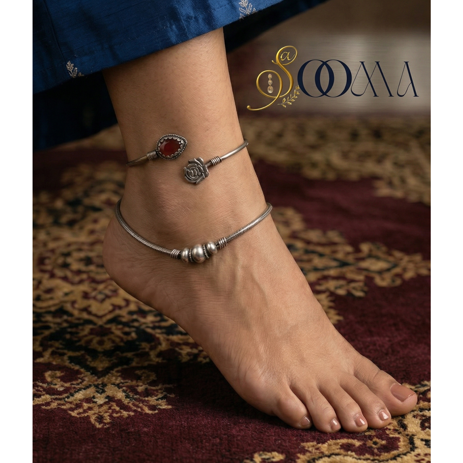 Close-up of an Ankle with stone anklet kada showing the metal finish and stone settings.