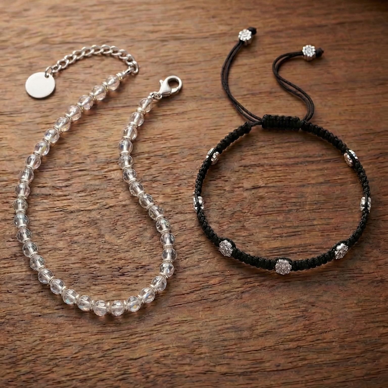 Two anklets on a wooden surface with 'Sooma' branding.