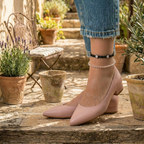 A model wearing handcrafted anklet stack with intricate details