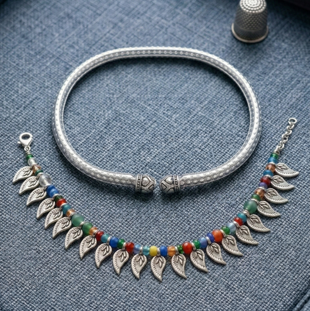 Multi-strand bead anklet stack & kada on a textured surface