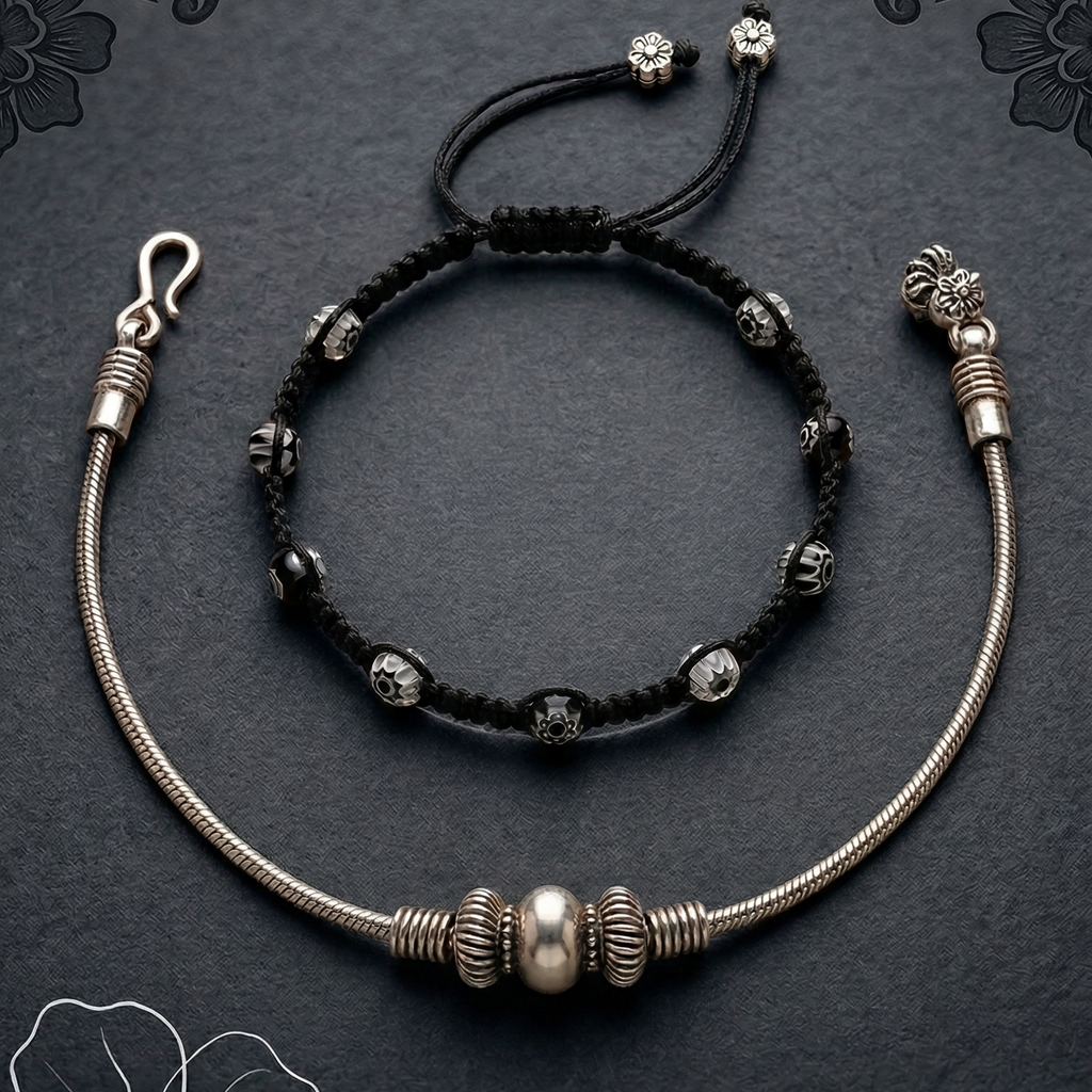Elegant anklet stack featuring layered designs and a polished finish, perfect for office wear on a dark surface.