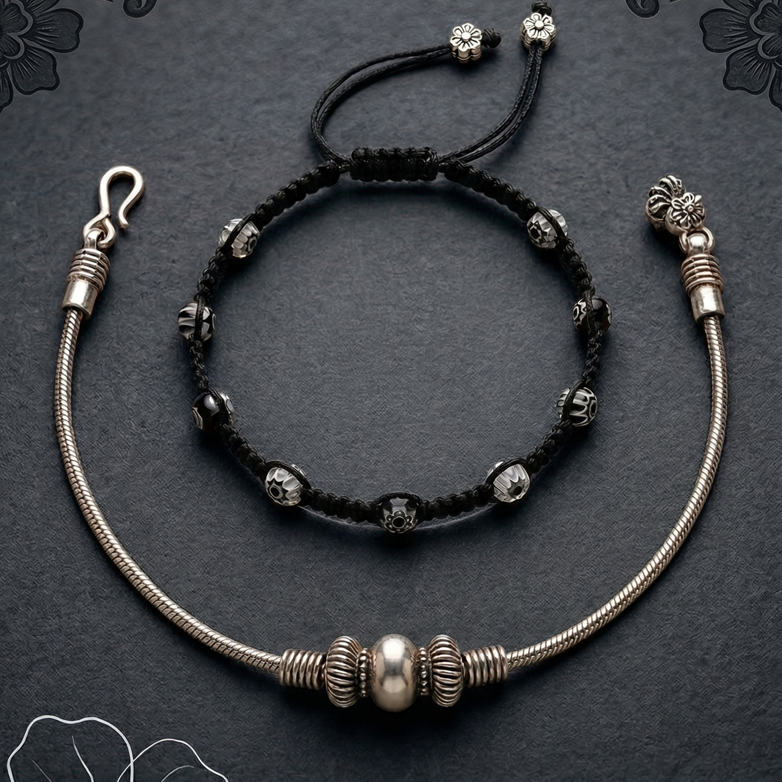 Elegant anklet stack featuring layered designs and a polished finish, perfect for office wear on a dark surface.