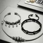 Elegant anklet stack featuring layered designs and a polished finish, perfect for office wear, on a textured surface with a sooma logo in the background.