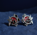 Multicolor Stone Oxidized Silver Bird Earrings on a blue background