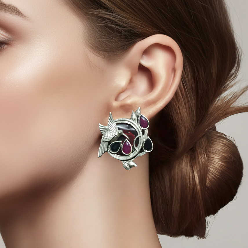 Close-up of a woman wearing Multicolor Stone Oxidized Silver Bird Earrings 