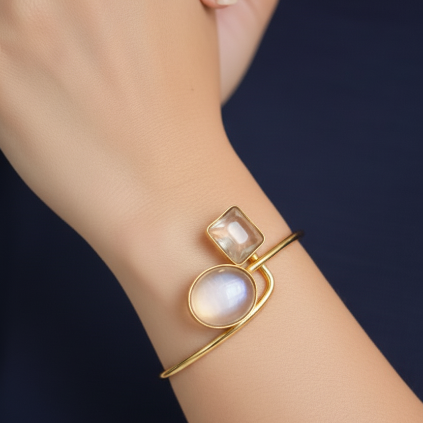 A women's hand adroned in elegant clear stone gold plated minimalist bracelet 
