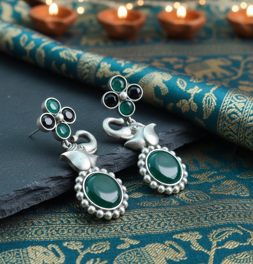 Pair of silver and green Elephant Stone Drop Earrings showcasing intricate stone work and elegant design.