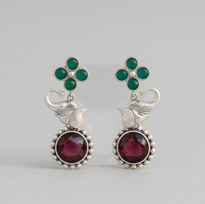 Pair of Multicolor Elephant Stone Drop Earrings showcasing intricate stone work and elegant design on a light background.