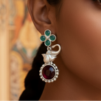 Close-up of a woman wearing Multicolor Elephant Stone Drop Earrings showcasing intricate stone work and elegant design.