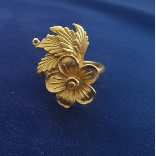 Elegant Pretty Rose Ring, high-quality imitation jewelry for modern women, against a blue background.