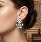 Close-up of a woman wearing White Kundan Stud Earrings