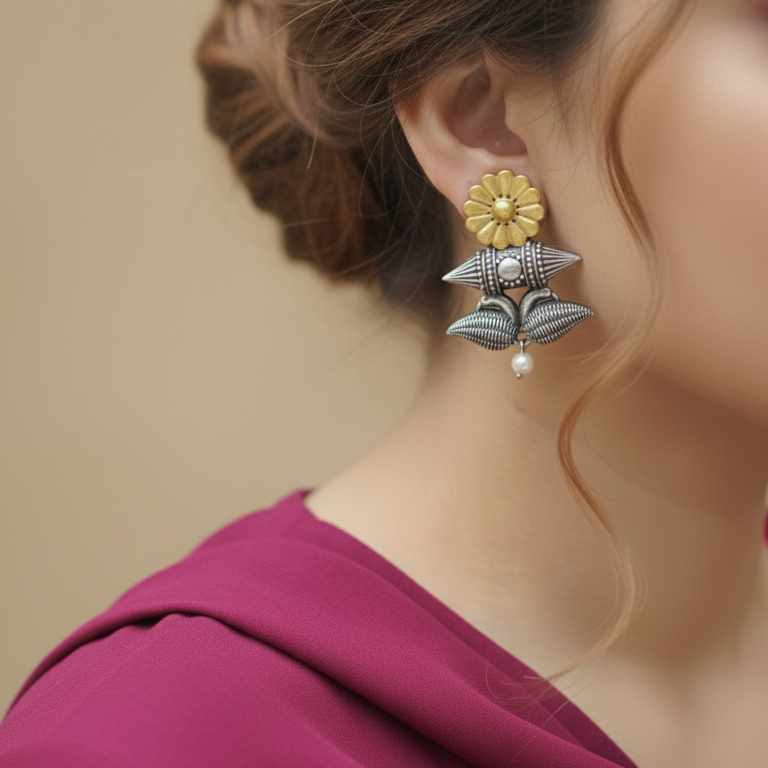Close-up of a woman wearing a  Flower Dual Tone Earrings showcasing the floral design and dual-tone finish.