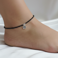 Minimalist anklet with adjustable chain on a woman's ankle
