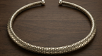 Hasli necklace on wooden surface