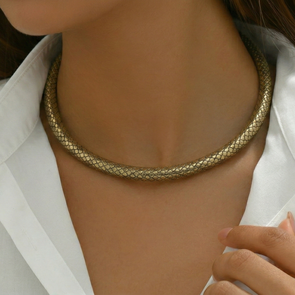 Rust hasli worn by a person with a white shirt