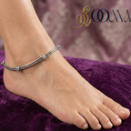 A Woman Wearing Oxidised Silver Snake Chain Anklet