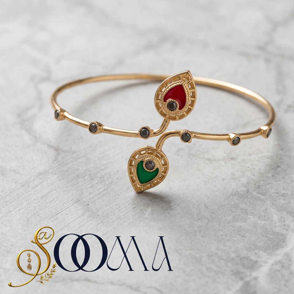 A gold-plated bangle bracelet with two teardrop-shaped enamel inlays, one red and one green, accented with small black stones, displayed on a light gray marble background with the brand name 'SOOMA' at the bottom.