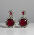 Stylish red stone stud earrings for women .