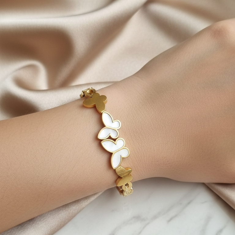 Gold plated butterfly bracelet on a wrist