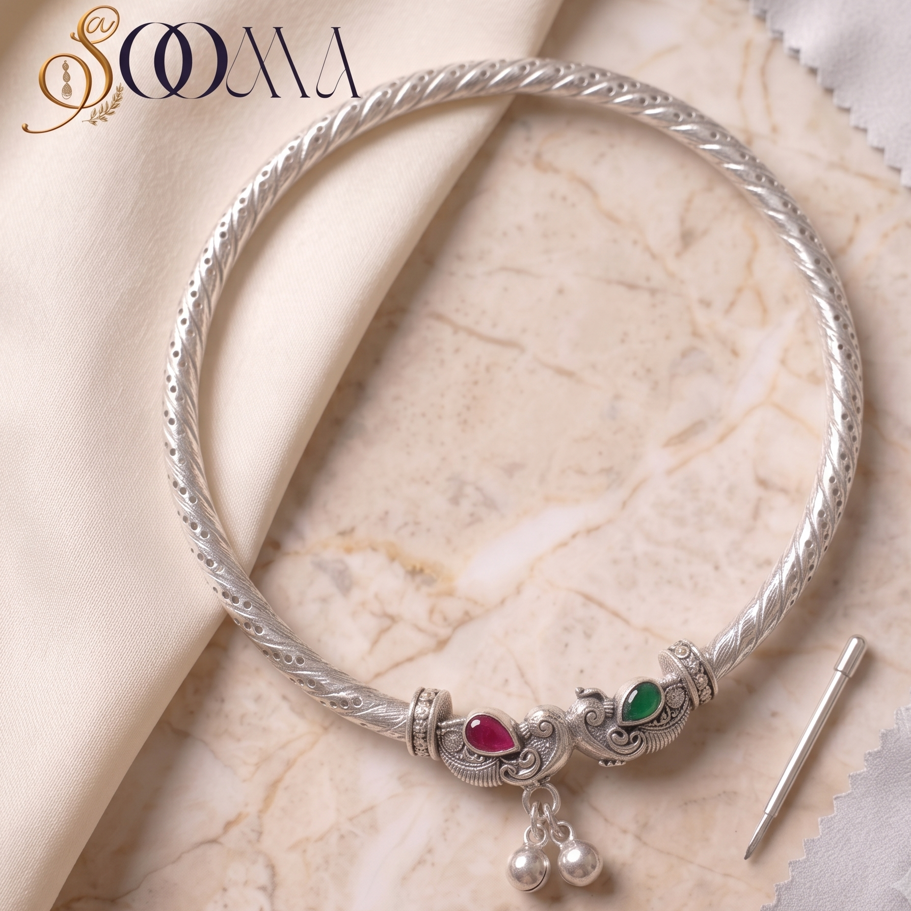 Handcrafted rigid silver kada anklet featuring dual elephant heads with stone studs 