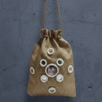 Jute drawstring bag with decorative elements on a gray background