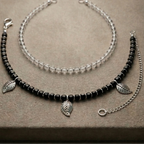 Close-up of beaded and charm anklet stack on ankle