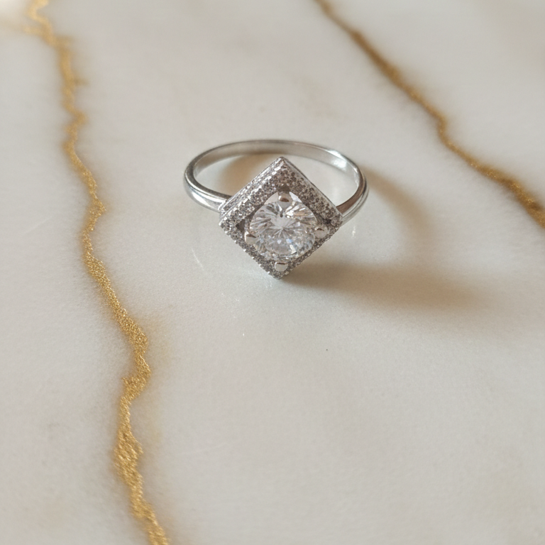 A Trendy AD Ring for Office Wear on Marble Surface