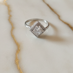 A Trendy AD Ring for Office Wear on Marble Surface