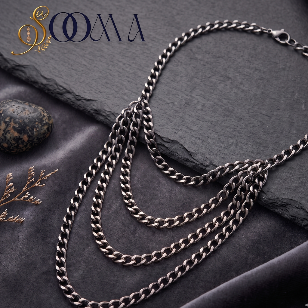 Sooma brand layered silver curb chain armlet bajuband displayed flat on dark slate and velvet