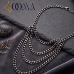 Sooma brand layered silver curb chain armlet bajuband displayed flat on dark slate and velvet