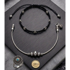 Elegant anklet stack featuring a polished metal finish and subtle stone detailing.