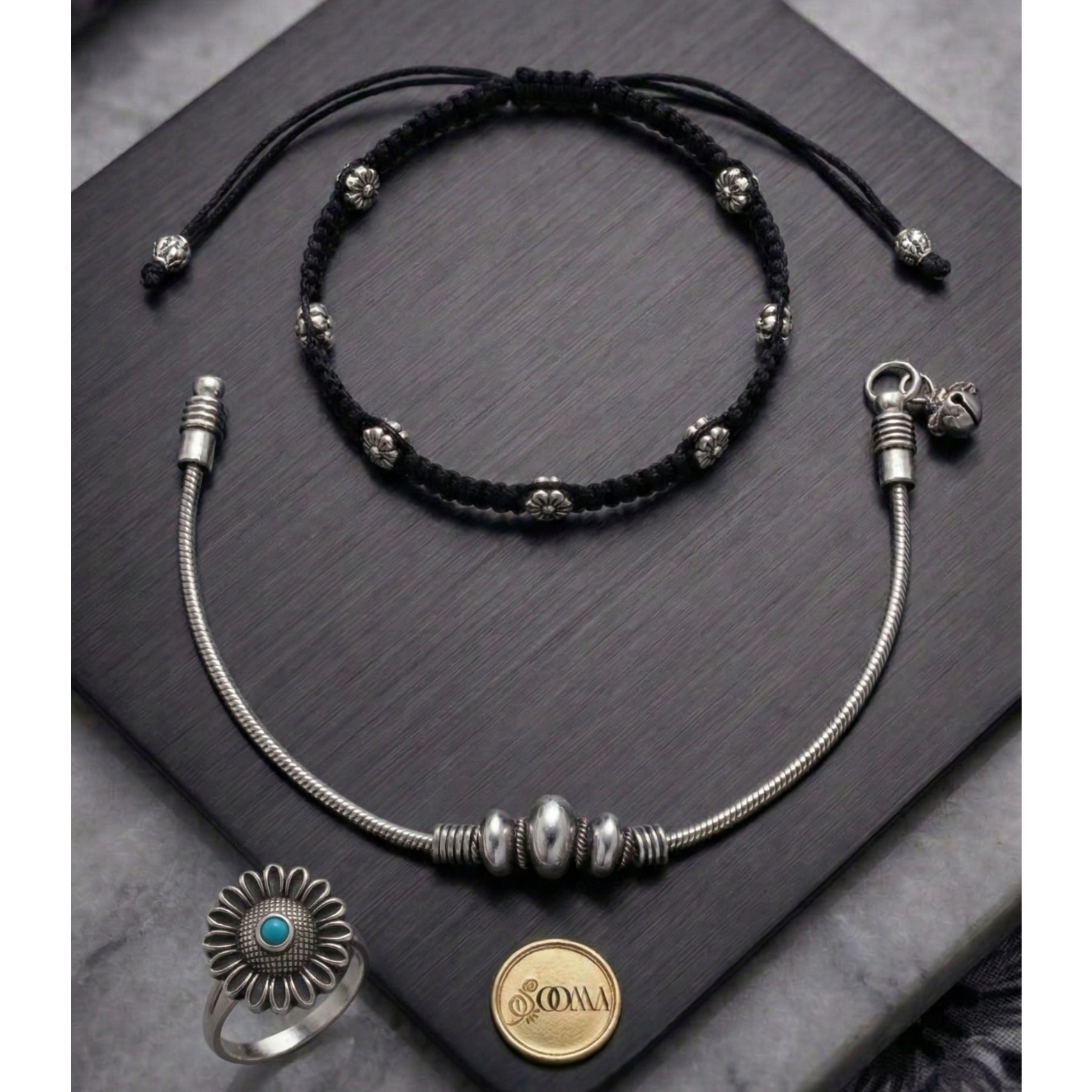 Elegant anklet stack featuring a polished metal finish and subtle stone detailing.